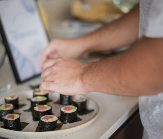 Rainbow Roll with Prawn, Salmon, Tuna, and Avocado A Rainbow Roll with prawn, salmon, tuna, and avocado.